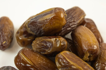 Dried dates  on white background.