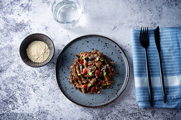 Spicy roasted eggplant with pepper in a dish