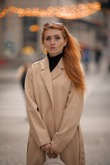 woman walking down the street. walk through the autumn city	