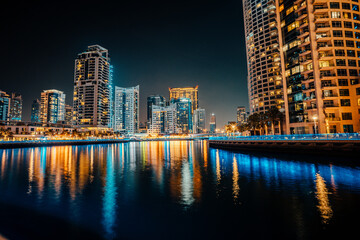 Fototapeta na wymiar Fantastic nighttime skyline with illuminated skyscrapers. Dubai, UAE
