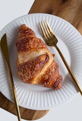 croissant fork and knife in the plate