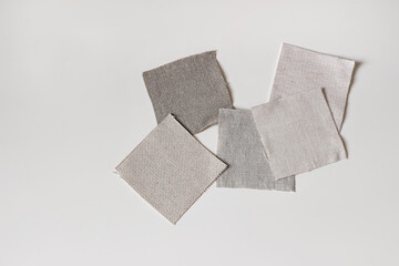 Fabric samples. Linen, cotton and velevt textile swatches isolated on white table backgound. Flat...
