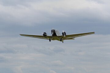 an old three-engine airliner in flight, the Ju 52