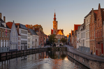 Fototapeta na wymiar Spiegelrei canal and Jan Van Eyck Square In Brugge, Belgium at sunrise