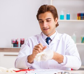 The young expert criminologist working in the lab