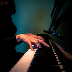 Fototapeta na wymiar creative shot of a woman playing the piano