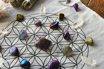 A top view image of a healing crystal grid using the flower of life sacred geometry.