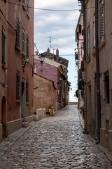 Empty, old, stone paved narrow streets of Rovinj, popular tourist destination with beautiful, colorful houses in the Istrian region of Croatia
