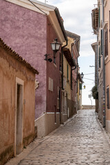 Empty, old, stone paved narrow streets of Rovinj, popular tourist destination with beautiful, colorful houses in the Istrian region of Croatia