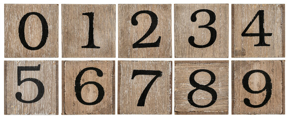 a set of isolated 10 numbers from zero to nine - rough black painting on a grunge wooden blocks