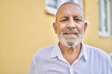 Senior man smiling confident at street