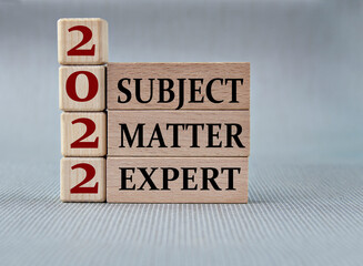 SUBJECT MATTER EXPERT 2022 - words on wooden blocks on gray background