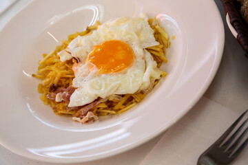 Huevo cabreado (Angre eggs) served on plate - Catalonian cuisine