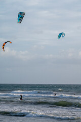 Water sport at cold winter water of Tyrrhenian sea between two touristic towns Sperlonga and Terracina in Lazio, Italy