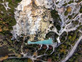 Fototapeta premium Aerial view on free hot thermal springs and pool in nature park Dei Mulini, Bagno Vignoni, Tuscany, Italy