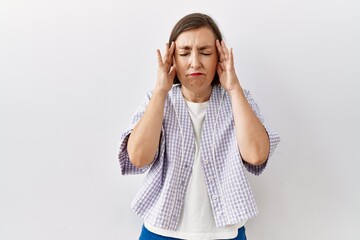 Beautiful middle age hispanic woman standing over isolated background showing middle finger, impolite and rude fuck off expression