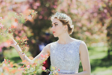 The beautiful woman in a dress with flowers.