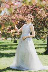 The beautiful woman in a dress with flowers.
