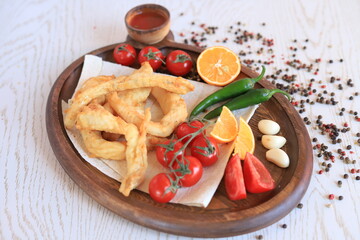 Fried fillet of carp with vegetables
