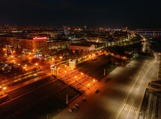 Fototapeta premium Volgograd embankment, promenade in the Park at night, aerial view from drone