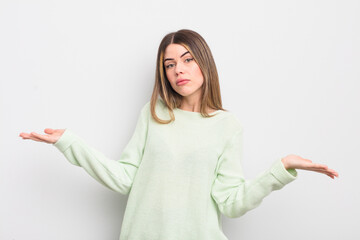 pretty young woman feeling puzzled and confused, unsure about the correct answer or decision,...