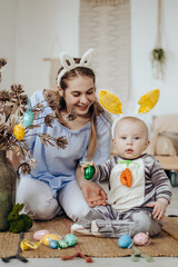 Mother and child get ready to celebrate Easter. Child in Easter Bunny Costume