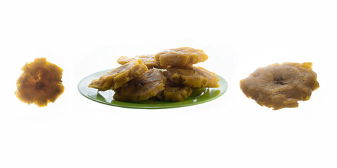 Patacones on white background. Fried plantain. Green plate.