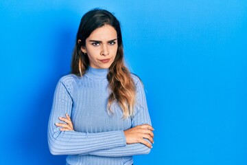 Young hispanic girl wearing casual clothes skeptic and nervous, disapproving expression on face...