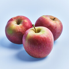  Group of red apples fruits over blue background