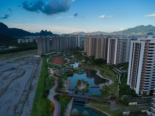 Aerial view of Ilha Pura Park at sunset. In the background, the hills of Rio de Janeiro, Brazil and...