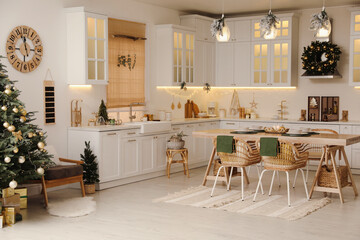 Cozy open plan kitchen decorated for Christmas. Interior design