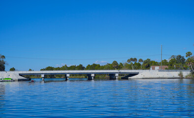 beautiful tree, house along homossasa river in winter. 