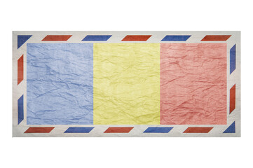 Fototapeta na wymiar Postal envelope. Envelope with the image flag of Romania. Romanian flag. Faded crumpled envelope with no postmark. Copy space. Blank mock up.