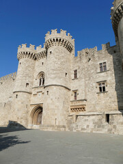 Fototapeta na wymiar Massive medieval walls and towers guard Palace of the Grand Master