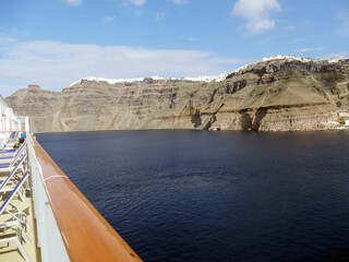 White buildings lining the caldera crater walls