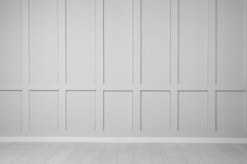 Empty white wall and wooden floor in room