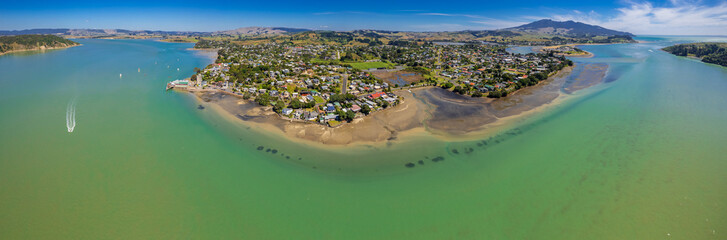 Fototapeta na wymiar Aerial drone panoramic view over the seaside town of Raglan, on the West Coast of the Waikato region in the North Island of New Zealand.