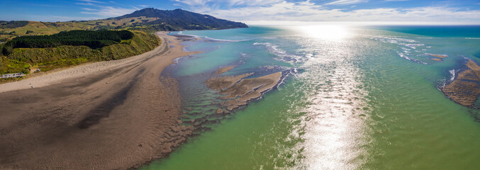 Aerial drone panoramic view over the seaside town of Raglan, on the West Coast of the Waikato region in the North Island of New Zealand.