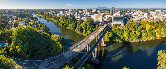 Panoramic aerial drone view over the city of Hamilton (Kirikiriroa) in the Waikato region of New Zealand. - obrazy, fototapety, plakaty