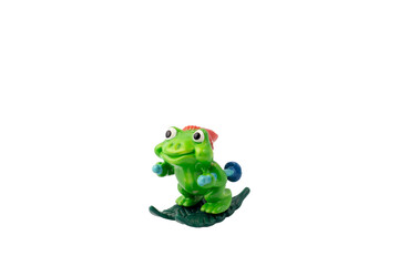 Frog figure plastic toy on a white isolated background