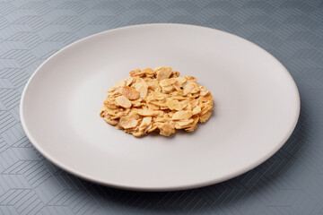 Florentina's macaroons. Almond petal cookies on a plate. Gray background
