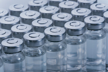 Glass medical ampoule vial for injection. Medicine is dry white drug penicillin powder or liquid...