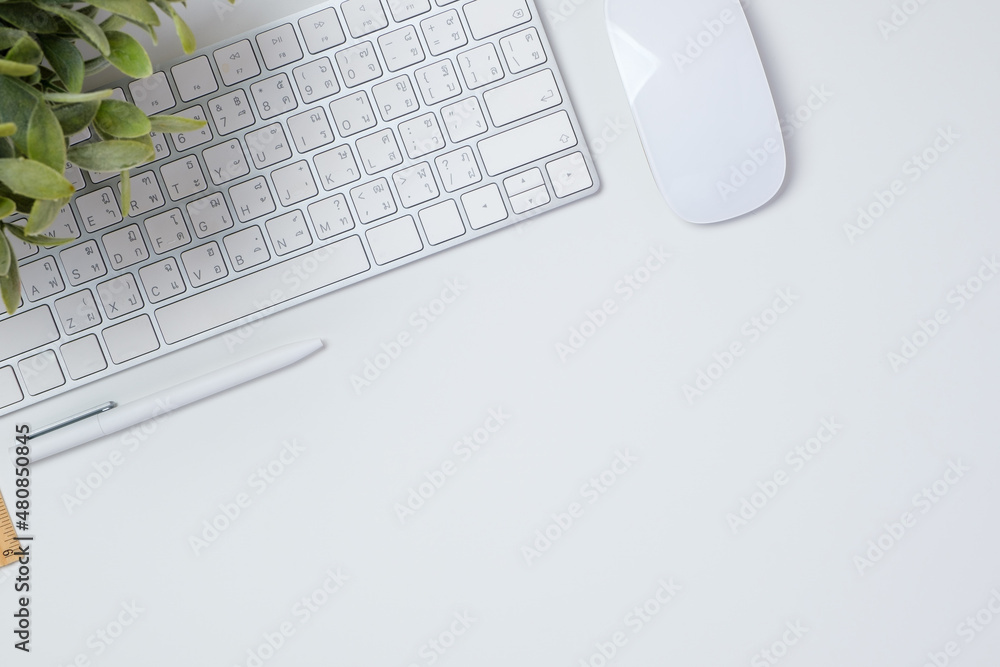 Poster top view working desk with keyboard mouse and notebook on white table backgorund