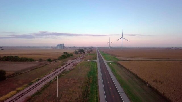 Wind-mill Turbines Spin Creating Green Renewable Clean Energy Electricity With Net Zero Greenhouse Gas Carbon Footprint Emissions To Reduce Climate Change In Wheat Fields Of Nebraska Stock Video #11