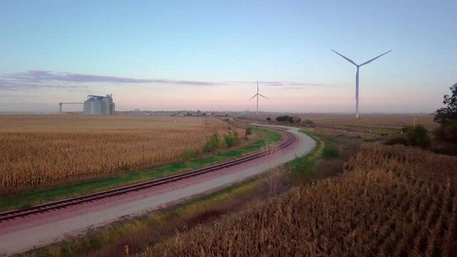 Wind-mill Turbines Spin Creating Green Renewable Clean Energy Electricity With Net Zero Greenhouse Gas Carbon Footprint Emissions To Reduce Climate Change In Wheat Fields Of Nebraska Stock Video #13