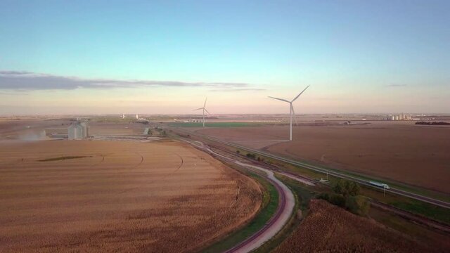 Wind-mill Turbines Spin Creating Green Renewable Clean Energy Electricity With Net Zero Greenhouse Gas Carbon Footprint Emissions To Reduce Climate Change In Wheat Fields Of Nebraska Stock Video #4