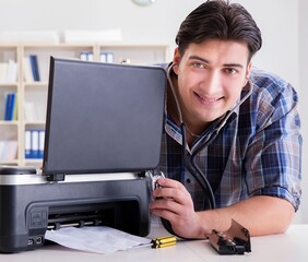Repairman repairing broken color printer