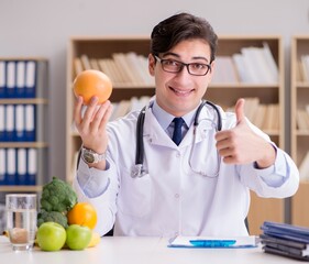 Doctor in dieting concept with fruits and vegetables