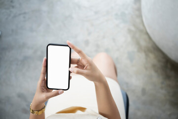 Female office worker using smart phone at office.