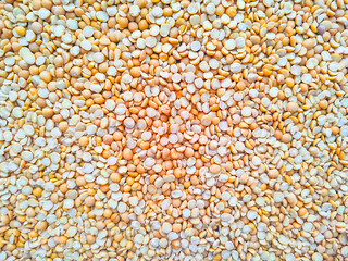 Dried yellow split peas background - vegetarian food